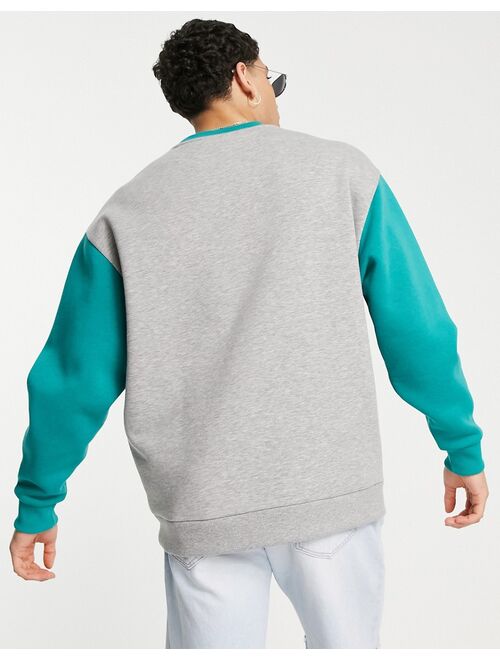 ASOS DESIGN oversized sweatshirt with vintage print and contrast raglan sleeves