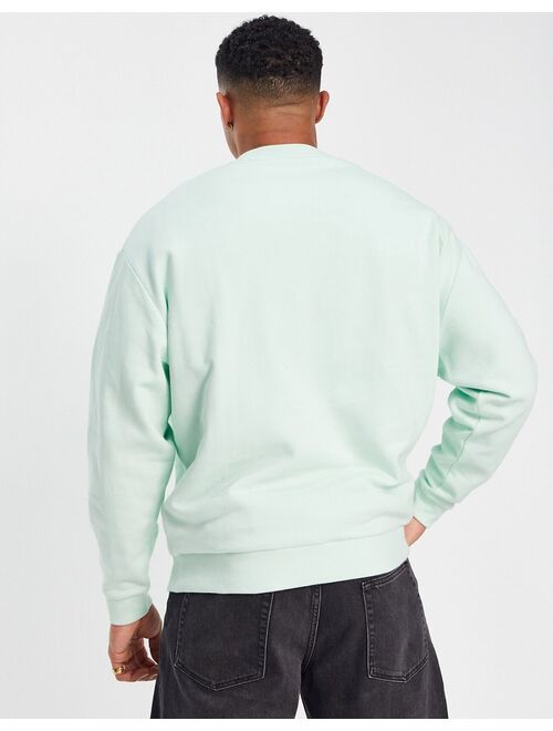 ASOS DESIGN oversized sweatshirt in pastel green