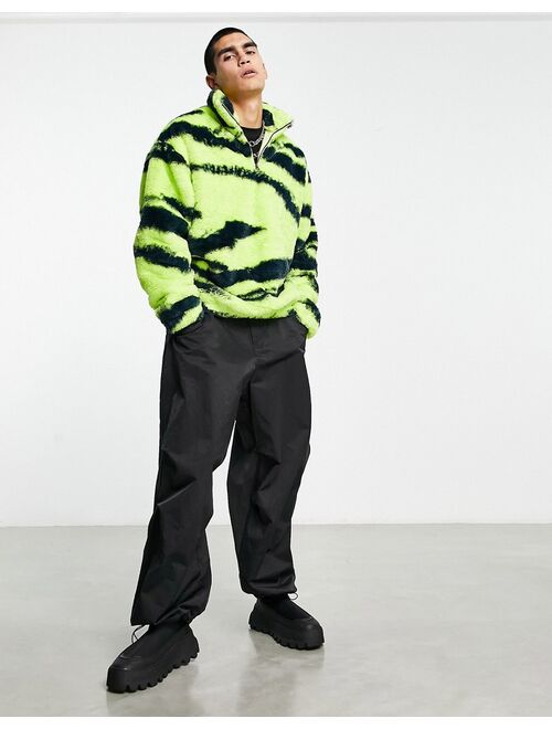 ASOS DESIGN oversized half zip faux fur sweatshirt with green zebra print