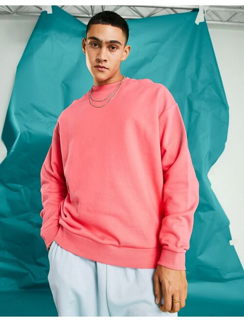ASOS DESIGN oversized sweatshirt in pink