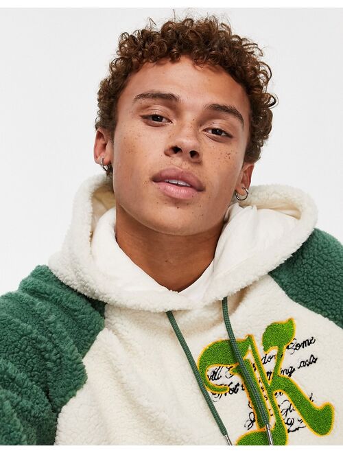 ASOS DESIGN oversized borg hoodie in green color block with varsity badge