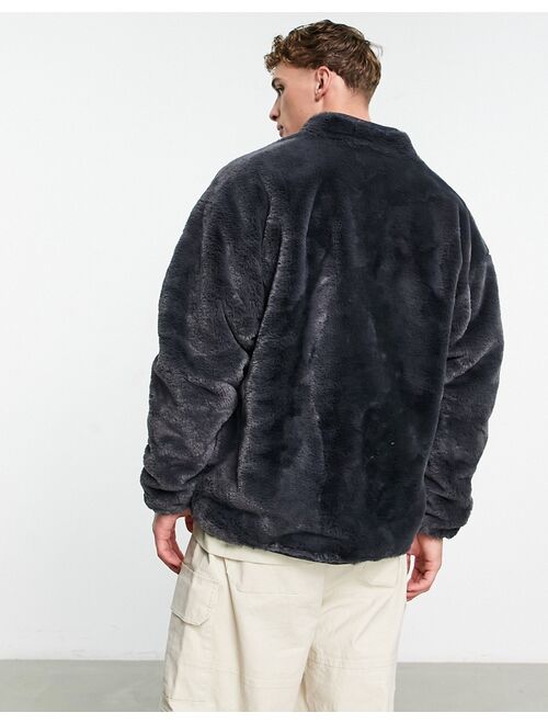 Buy ASOS DESIGN oversized track jacket in washed black faux fur online