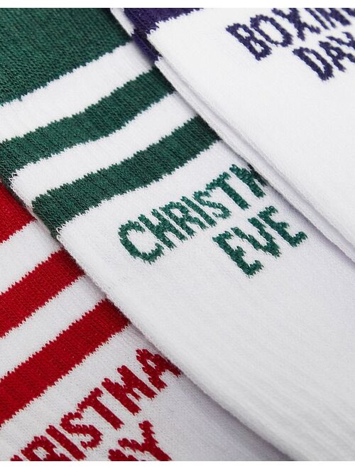 ASOS DESIGN 3 pack sports socks in white with Christmas days slogan