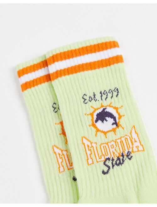 ASOS DESIGN sport socks in green with Florida State print