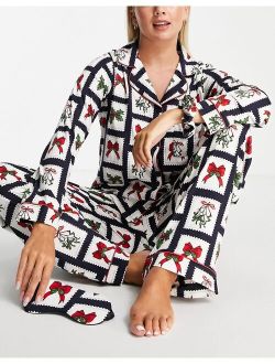 Chelsea Peers top and pants pajama set with eyemask and scrunchie in christmas stamp print