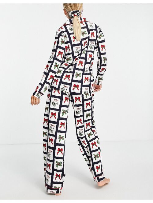 Chelsea Peers top and pants pajama set with eyemask and scrunchie in christmas stamp print