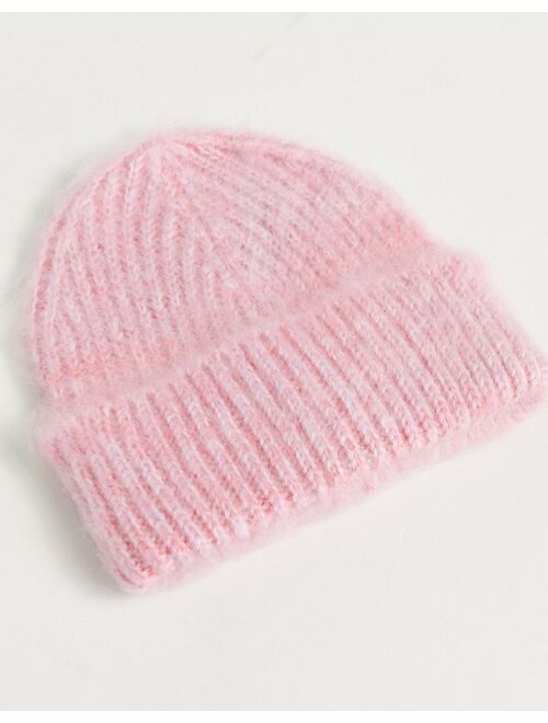 ASOS DESIGN two tone fluffy beanie in pink