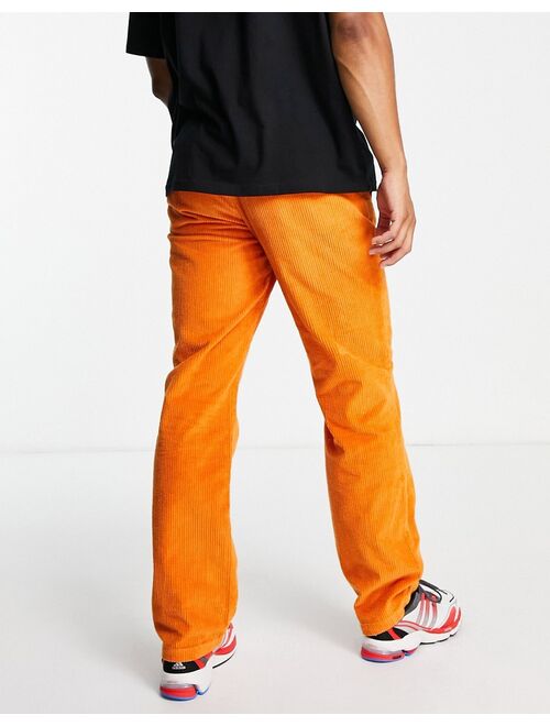 Topman relaxed cord pants in orange
