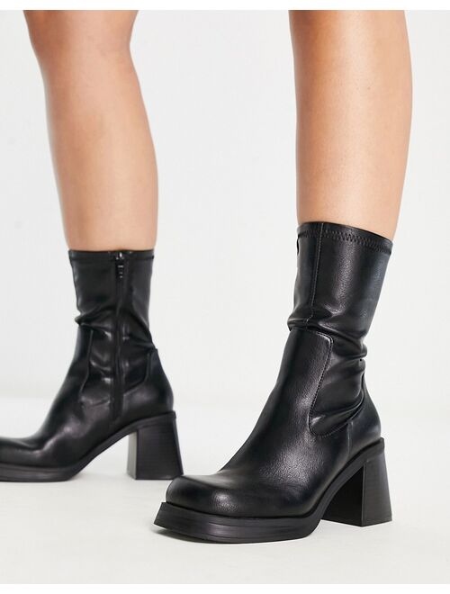 ASOS DESIGN Wide Fit Reversed mid-heel sock boots in black