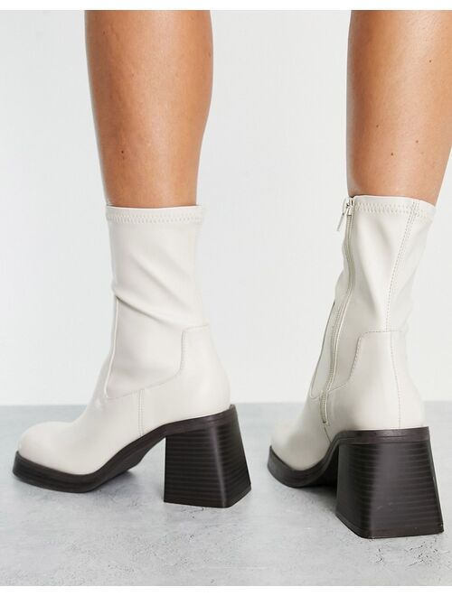 ASOS DESIGN Reversed mid-heel sock boots in off white