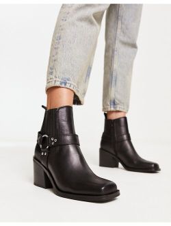Wells heeled boots with harness detail in black leather