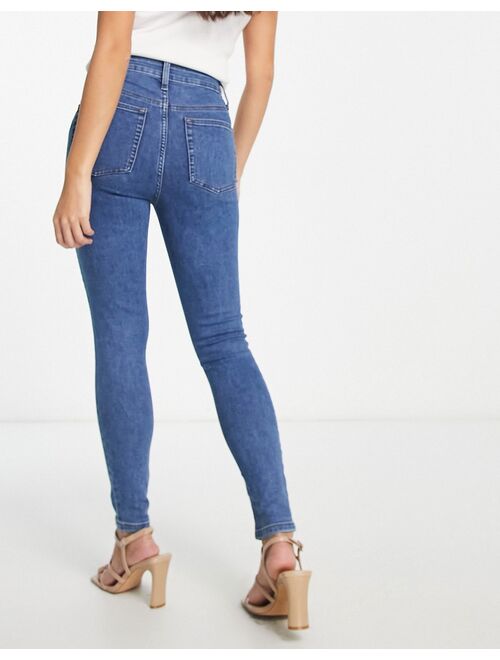 ASOS DESIGN Petite skinny jeans in mid blue