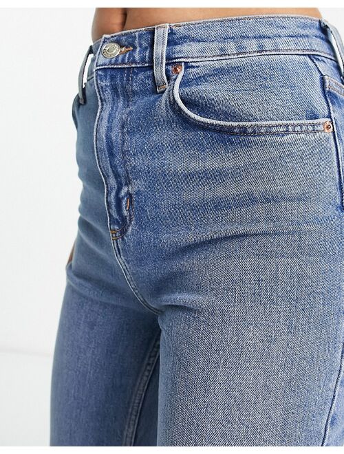 ASOS DESIGN flared jeans in mid blue