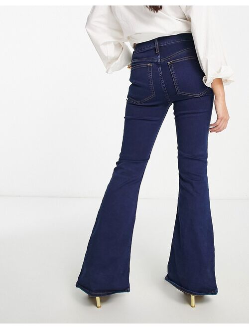 ASOS DESIGN Petite power stretch flared jeans in dark blue
