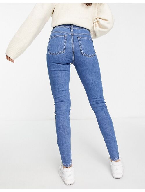 ASOS DESIGN skinny jeans in mid blue