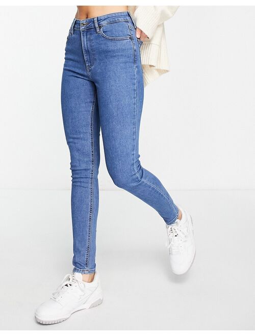 ASOS DESIGN skinny jeans in mid blue