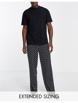 pajama set with T-shirt and pants in black and white spot