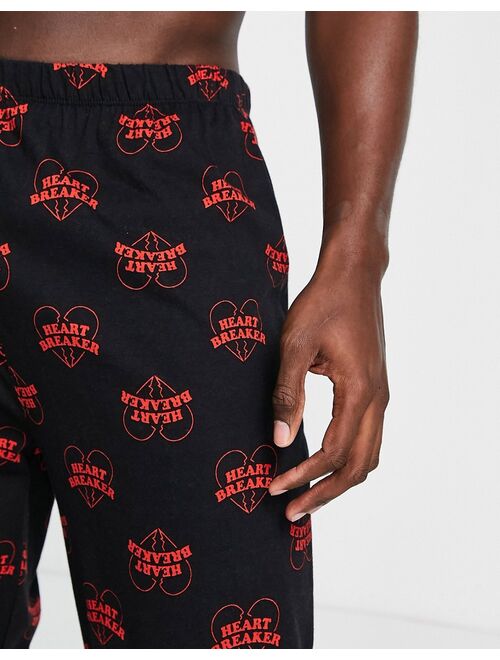 ASOS DESIGN lounge bottoms in black with heart print