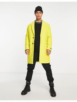 Devils Advocate longline coat in yellow