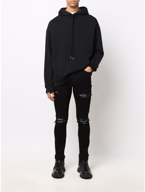 AMIRI ripped-detailing skinny jeans