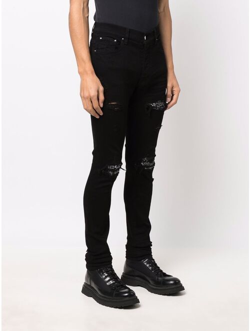 AMIRI ripped-detailing skinny jeans