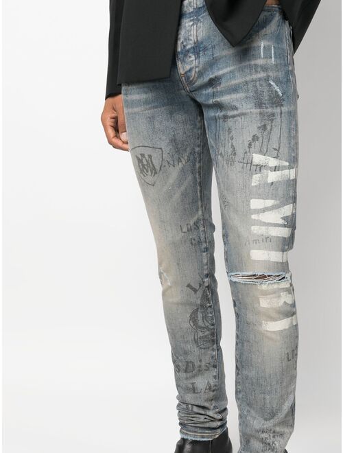 AMIRI slim-fit illustration print jeans