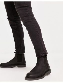 leather chelsea boots in black with ribbed sole