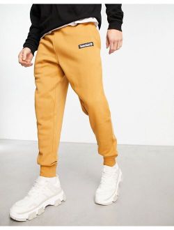 Woven Badge sweatpants in tan