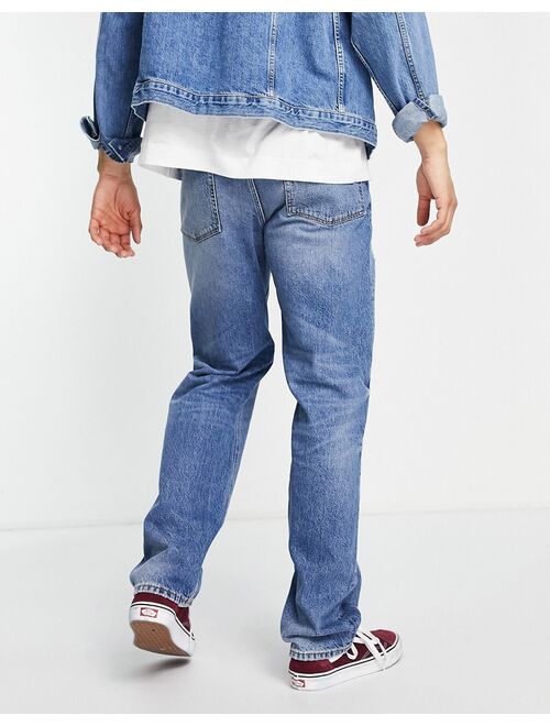 ASOS DESIGN wide straight jean in mid wash with rips