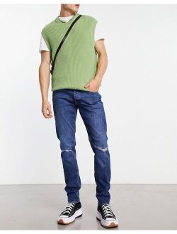 Intelligence glenn slim fit super stretch jean with rips in mid wash blue