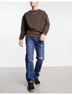 Edge loose fit jeans in mid wash with rips