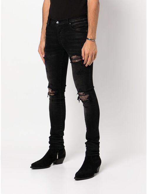 AMIRI paisley-patch distressed skinny jeans