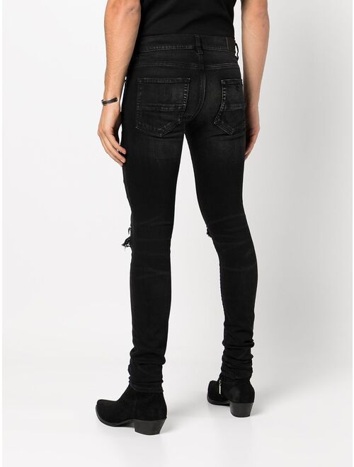AMIRI paisley-patch distressed skinny jeans
