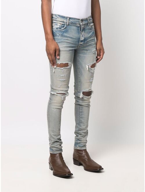 AMIRI distressed skinny jeans