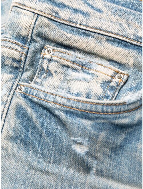 AMIRI distressed skinny jeans