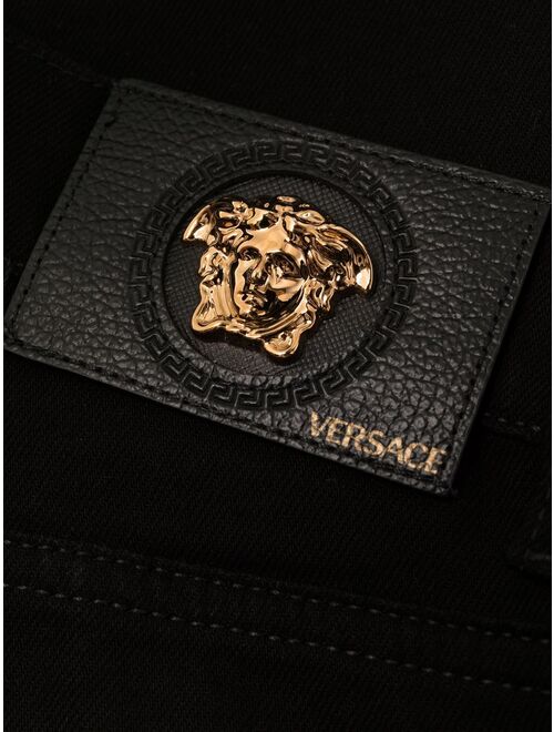 Versace Medusa-plaque bootcut jeans