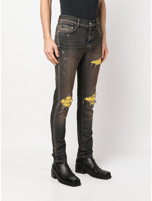 AMIRI ripped-detail skinny jeans