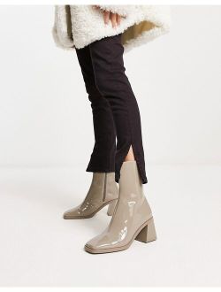 vegan patent heeled boot in taupe