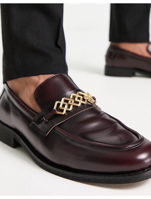 ASOS DESIGN loafers in burgundy faux leather with gold brooch detail