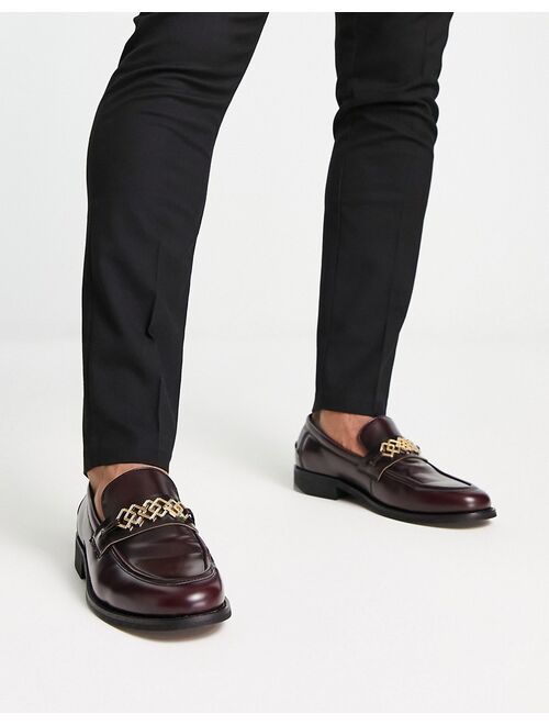 ASOS DESIGN loafers in burgundy faux leather with gold brooch detail