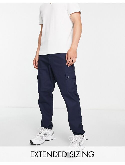 ASOS DESIGN tapered cargo pants in navy with toggles