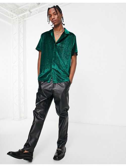 ASOS DESIGN relaxed velvet shirt with embossed snake print in green