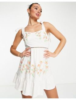 cup detail sundress with tie shoulders with cream and coral floral embroidery
