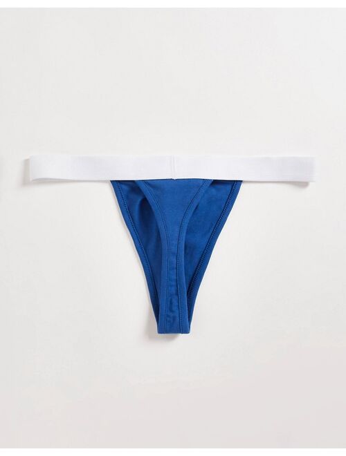 ASOS DESIGN thong in blue with white waistband