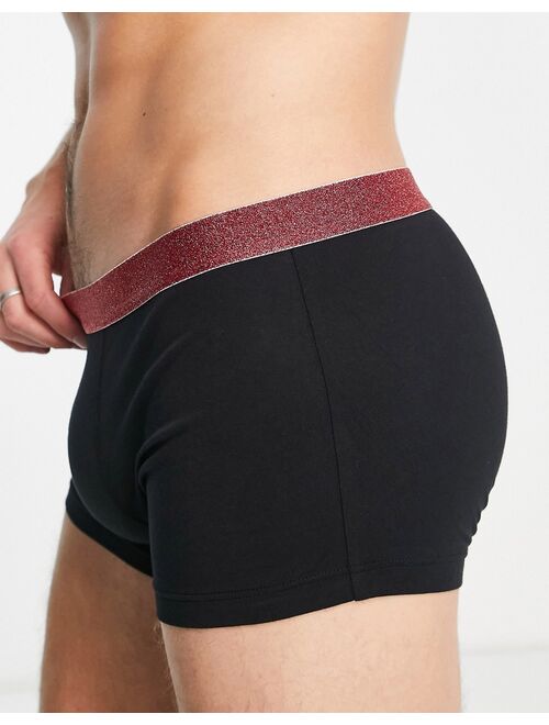 ASOS DESIGN jersey trunks in black with red glitter waistband
