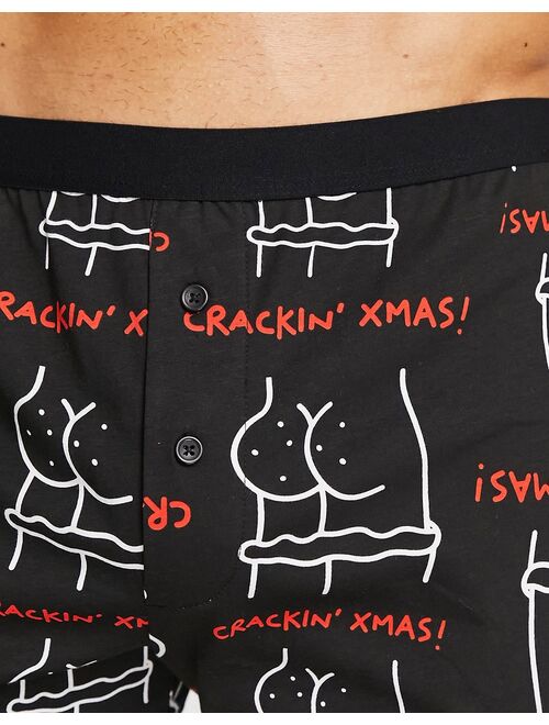 ASOS DESIGN jersey boxers in black Christmas print