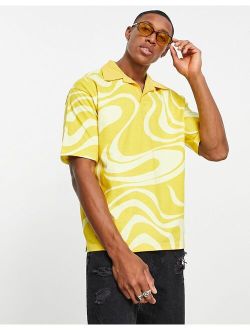 swirl print polo shirt in yellow -Exclusive to ASOS