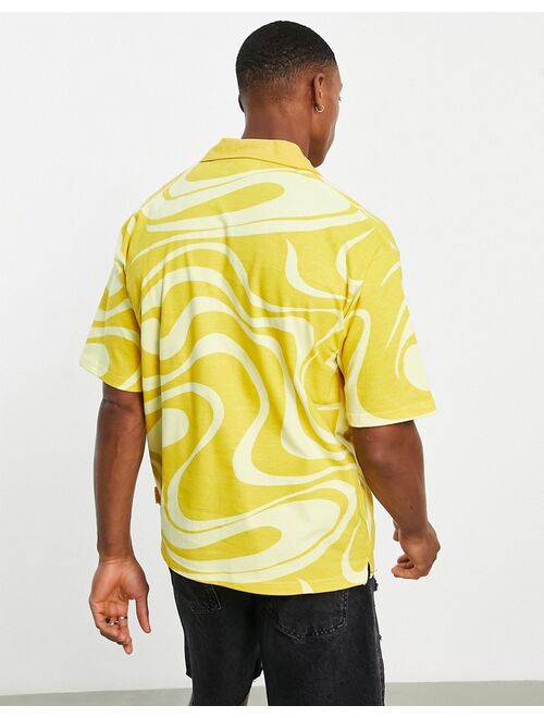 Fila swirl print polo shirt in yellow -Exclusive to ASOS