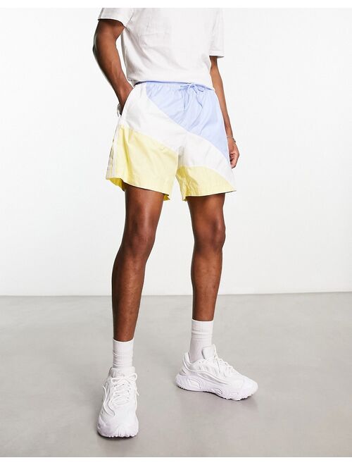 adidas Originals Superstar shorts in blue and yellow