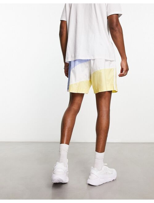 adidas Originals Superstar shorts in blue and yellow